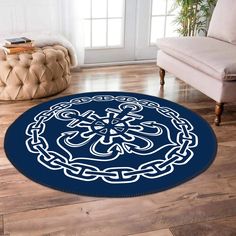 a blue and white rug with an intricate design on the floor in a living room