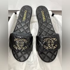 Black Lambskin Leather Gold Cc Chain Logo Quilted Chanel Puffy Sandals, Channel Slippers Women, Chanel Dad Sandals 2022, Chanel Rubber Sandals, Channel Strap Sandals, Chanel Jesus Sandals, Chanel Sandals 2022, Chanel Leather Slides, Leather Sandals With Chain Strap And Open Heel