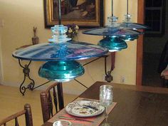 two blue glass plates on top of a wooden table