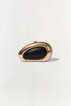 FALL 2024 WOMEN'S COLLECTION The Luna Clutch in Black Gold. Featuring a sleek gold frame and sophisticated black center, elevate your evening ensemble with this chic oval clutch. Elegant Structured Clutch For Formal Occasions, Elegant Structured Formal Clutch, Black Elegant Clutch For Formal Occasions, Modern Gold Clutch For Party, Elegant Black Clutch For Gala, Elegant Black Clutch For Formal Occasions, Modern Gold Evening Bag For Formal Events, Modern Structured Clutch For Formal Occasions, Modern Formal Evening Bag