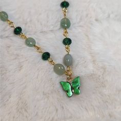 Green Aventurine And Glass Crystal Beaded Gold Choker Necklace With Green Butterfly Charm Measures Approximately 14" And Is Finished With A Gold Toned Stainless Steel Chain With A Lobster Clasp And 1.5" Extension Chain. Green Jade Beaded Chain Jewelry, Green Jade Jewelry With Beaded Chain, Green Aventurine Pendant Crystal Necklace, Jade Beaded Pendant Necklaces As Gift, Jade Beaded Pendant Necklaces For Gifts, Green Beaded Chain Crystal Necklace Gift, Jade Pendant Beaded Necklaces As Gift, Jade Pendant Beaded Necklaces For Gifts, Jade Pendant Beaded Necklace For Gifts