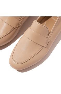 A squared-off moc toe and rich leather upper add sophisticated elements to a luxe loafer set on a cushioned footbed and slip-resistant rubber sole. Cushioned footbed with arch support Leather upper/textile lining/rubber sole Slip-resistant sole Imported American Podiatric Medical Association (APMA) Seal of Acceptance Classic Beige Slip-ons For Office, Classic Slip-on Flats With Square Toe, Classic Beige Slip-ons With Cushioned Footbed, Office Slip-on Loafers With Cushioned Footbed, Classic Square Toe Flats With Leather Sole, Classic Leather Square Toe Flats, Beige Loafers With Cushioned Footbed And Flat Heel, Beige Loafers With Removable Insole For Work, Classic Beige Loafers With Leather Footbed