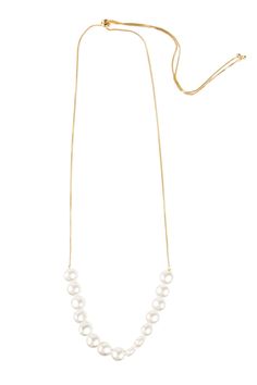 We've updated the classic pearl necklace by incorporating an adjustable slide closure - making it super easy to wear long or short. Our Motee Necklace is elegant and timeless, and perfect for any occasion. Materials: Gold Plated, Pearls, Copper Size :18" x 0.25" Adjustable Cord Imported Chic Adjustable Pearl Necklace, Adjustable Delicate Chain Pearl Necklace For Everyday, Chic Pearl Necklace With Adjustable Chain, Adjustable Pearl Lariat Necklace With Pearl Charm, Long Pearl Necklace With Adjustable Chain, Adjustable Everyday Pearl Chain Necklace, Everyday Adjustable Pearl Chain Necklace, Chic Long Pearl Necklace With Adjustable Chain, Formal Adjustable Pearl Necklace With Pendant