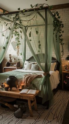 a bedroom with a bed covered in green curtains and plants hanging from the ceiling above it