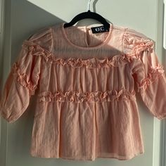 New Osmond & Co, Girls Size: Small, Medium, X- Large Color: Peach Tags Attached, Peach Ruffle Textured Shirt 3 Available Orange Short Sleeve Blouse With Ruffles, Orange Ruffled Short Sleeve Blouse, Cute Ruffled Tops For Brunch, Cute Pink Tops For Brunch, Peach Ruffled Tops For Spring, Spring Peach Ruffled Tops, Cute Spring Blouse With Ruffles, Cute Ruffled Spring Blouse, Cute Ruffled Blouse For Spring