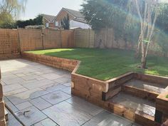 a backyard with grass and wooden steps