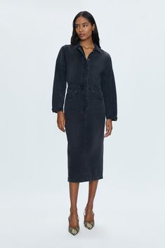 Rigid denim dress with a midi length skirt, designed with a dropped, dollman sleeve silhouette. Center button and zippered closure, collared neckline and cuffed long sleeves. Coupe is a washed black colored denim with subtle notes of fading and whiskering. 100% Cotton Chic Long Sleeve Denim Dress For Casual Wear, Workwear Denim Dress With Button Closure, Chic Collared Denim Dress For Daywear, Chic Fall Midi Denim Dress, Dark Wash Long Sleeve Dresses For Work, Collared Denim Dress For Fall, Chic Mid-length Denim Dress For Work, Fall Denim Midi Dress With Button Closure, Long Sleeve Dark Wash Dresses For Work