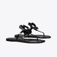 A sculpted bloom embellishes a classic flip-flop sandal with a playful focal point. The jelly outsole is perfect for the beach or to wear poolside. Chanel Jelly Sandals, Flower Jelly, Jelly Flower, Christmas Guide, Flower Sandals, Beach Slides, Jelly Sandals, Footwear Design Women, Designer Sandals