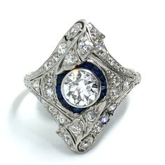 VINTAGE NATURAL BLUE SAPPHIRE & DIAMOND 1.39CT COCKTAIL RING PLATINUM ESTATE  Wonderful Vintage Condition  Comes in a ring box Center stone approx 0.65 carats, I-J - SI Side diamonds 0.50cts with I-J - SI Blue Sapphire 0.24ct 6.1 grams Platinum Size 7 If you have received the item and has not met the “as advertised” we will work out some sort of arrangement, let’s try and solve the issue so the buyer and the seller are happy with the outcome. Blue Sapphire Diamond, Natural Blue Sapphire, Halo Ring, Halo Rings, Sapphire Diamond, Cocktail Ring, Ring Box, Cocktail Rings, Blue Sapphire