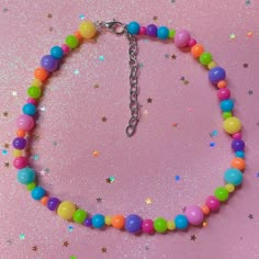 "💖 A colorful choker to match any bold playful looks! ☺️💕💖 14.5\" long, but feel free to DM about extensions! :)  Will ship out in 1-2 days! 💖 Check out my Depop for a larger choker selection! : D https://www.depop.com/jenniichii/" Pink Beaded Choker, Decora Necklace, Trinket Ideas, Rave Kandi Ideas, Decora Accessories, Diy Friendship Bracelets Easy, Colorful Choker, Kandi Inspo, Diy Kandi Bracelets