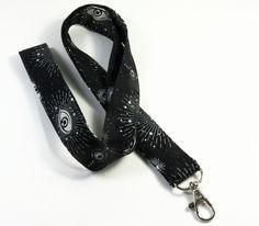 This cute lanyard has beautiful eyes with stars and moon on black. It is perfect for any occasion. You can leave me a convoy if you need a different size. You can have a wardrobe of lanyard to match your outfit. This lanyard is made of soft 100% cotton fabric to give a comfortable feel around your neck. This lanyard is easy to take care. You can spot clean and throw in a washer and hang dry. If you want you can iron and it is ready to use. These lanyards are perfect if you have metal allergy. Ea Black Lanyard With Key Leash For Personal Use, Adjustable Black Lanyards For Personal Use, Adjustable Black Badge Holder With Key Leash, Black Lanyard With Key Leash As Gift, Handmade Black Lanyards For Personal Use, Handmade Black Lanyards, Cute Lanyard, Cute Lanyards, Black Lanyard