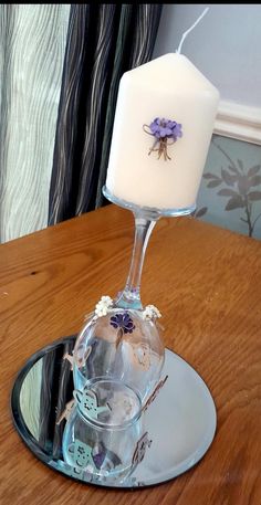 a candle that is on top of a glass