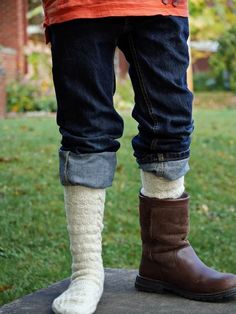 A long, warm, cozy pair of socks is everyone’s favorite once the fall winds begin to howl and this playfully textured pair in five sizes (XS/S/M/L/XL) is a delicious example. Worked from top cuff to toes, the easy to master knit/purl pattern is framed by a cable along each side. These boot socks work up speedily in a light, lofty sport weight yarn; the sporty, unisex design, flap heel, and multiple sizing make them a great gift pick Comfy Cozy Fit Socks For Fall, Cozy Comfortable Knee-high Socks For Fall, Warm Comfortable Fall Socks, Comfortable Snug Socks For Fall, Snug Comfortable Fall Socks, Comfortable Cozy Fall Socks, Cozy Chunky Knit Socks With Round Toe, Cozy Chunky Knit Socks, Cozy Outdoor Socks For Fall