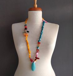 This pendant design necklaces are made with real gemstones with Italian murano glass beads mixture. Gemstones; turquoise (blue ones), coral stone (red ones), cornelian (yellow ones), quartz stone (pink ones), nacre stone (white ones), hematite (black-nacre), obsidian (black ones) and the brown ones are resin stone (ancient resin leached from pine trees). In this necklace, the most used one is cornelian and turquoise.  All of our products are made with high quality materials and do not tarnish. D Turquoise Pendant Beaded Necklace With Natural Stones, Turquoise Gemstone Beads Pendant Crystal Necklace, Turquoise Amulet Necklace With Large Beads, Turquoise Necklace With Large Beads As Gift, Unique Multicolor Beaded Turquoise Necklace, Multicolor Turquoise Necklace With Faceted Beads, Unique Multicolor Turquoise Necklace With Colorful Beads, Bohemian Multicolor Turquoise Necklace With Faceted Beads, Turquoise Pendant Beaded Necklace With Gemstone Beads