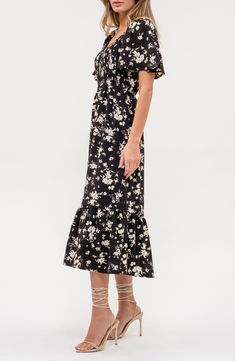 Layer and accessorize this smart midi dress however you want for a look that easily switches from the 9-to-5 to after-hours-ready in seconds. 48 1/2" length Slips on over head V-neck Short sleeves Partially lined 100% polyester Hand wash, dry flat Imported Knee-length Midi Dress For Work, Black Floral Print Midi Dress For Vacation, Black Short Sleeve Midi Dress For Brunch, Casual Black Knee-length Midi Dress, Black Short Sleeve Midi Dress For Spring, Black Sundress Midi Dress For Vacation, Black Midi Dress For Vacation, Black Maxi Dress For Brunch, Black Mid-length Dress For Day Out