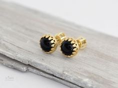 Gold stud earrings with natural black onyx. Made of 585/14k solid gold (rose, yellow or white - your choice). Stud size is 7 mm. Luxury Black Gemstone Earrings, Black Polished Finish Fine Jewelry Earrings, Black Gemstone Earrings For Anniversary, Formal Onyx Gemstone Earrings, Elegant Black Cabochon Earrings, Black Pierced Earrings In Fine Jewelry Style, Classic Yellow Gold Earrings With Black Enamel, Luxury Black Onyx Earrings, Black Pierced Earrings Fine Jewelry