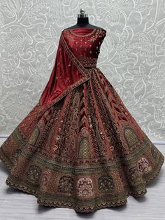 This stunning maroon color velvet bridal lehenga, exquisitely crafted to make you shine on your special day. The richness of the velvet material combined with intricate details such as multi-thread work, sequin work, diamond work, zari work, embroidered work, hand mirror work, and fancy dori work, ensures a masterpiece that epitomizes luxury and grace. The attention to detail in every stitch and embellishment speaks volumes about the craftsmanship that went into creating this ensemble.
Paired wi Engagement Gown, Velvet Lehenga, Lehenga Crop Top, Lehenga Choli Wedding, Floral Lehenga, Party Wear Lehenga Choli, Cocktail Wear, Bollywood Lehenga, Reception Gown