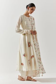 Ivory cotton mal anarkali with floral embroidery, mirror highlights. Paired with a scallop trimmed pant and dupatta with floral prints. - Aza Fashions Cream Floral Embroidered Dress For Diwali, Spring Chanderi Salwar Kameez With Mirror Work, Unstitched Floral Embroidery Anarkali Set, Anarkali Set With Floral Embroidery, Cream Anarkali Set With Floral Embroidery For Diwali, Spring Anarkali Salwar Kameez With Mirror Work, Cream Anarkali Set With Floral Embroidery For Designer Wear, Off White Anarkali Set With Floral Embroidery, Traditional Sharara With Floral Embroidery