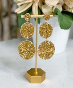 Introducing our enchanting "Dress Me Up" Earrings – a captivating accessory designed to add a touch of elegance and flair to any ensemble. These exquisite earrings feature a three-tier bead disk design that embodies a perfect balance of sophistication and style. Crafted with meticulous attention to detail, these earrings are adorned with delicate gold seed beads that shimmer and catch the light, making them a must-have addition to your jewelry collection.
Each earring is thoughtfully craft Elegant Beaded Circle Earrings, Gold Nickel-free Beaded Earrings For Party, Gold Beaded Round Metal Earrings, Round Metal Earrings With Gold Beads, Beaded Round Chandelier Earrings For Parties, Round Metal Beaded Earrings For Party, Party Metal Beaded Round Earrings, Party Round Beaded Earrings In Metal, Nickel Free Round Chandelier Earrings For Party