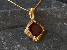 Gold Ruby Pendant set with a Created Ruby in a top quality, perfect clarity & stunning red color, at 12x12mm, weighting 7 Carats. Vintage Pendant design made of Gold Vermeil ☞ thickest 18k Gold Plating on top of Solid 925 Sterling Silver ☞ made to last. Free Vermeil Chain with every Pendant order, 18 inch Silver chain (46 cm) ✓ Matching Ring & Matching Earrings - please ask me ⌛Last Pendant left ⌛ Details : ♥ Each item comes in a cute GIFT BOX ✓ ♥ GUARANTEE on the materials ✓ ♥ Created Ruby in a Red Square Pendant Jewelry For Formal Occasions, Gold Garnet Jewelry With Diamond Accents, Hallmarked Square Pendant Jewelry For Formal Occasions, Elegant Garnet Jewelry With Diamond Accents, Gold Necklaces With Accent Stones For Formal Occasions, Formal Yellow Gold Necklace With Accent Stones, Gold Garnet Jewelry With Accent Stones, Elegant Gold Ruby Gemstones, Formal Pendant Jewelry With Accent Stones