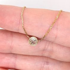 Elevate your style with this luxurious yet minimalist solitaire diamond necklace. Crafted with a 5mm round cut diamond, bezel set in solid 14k white, yellow or rose gold. A perfect accent to your everyday wear and perfect for April birthdays. Enjoy the beauty of natural diamonds! Choose between a 16" and 18" chain so we can make sure your pendant is perfectly centered! Minimalist Bezel Set Solitaire Necklace For Anniversary, Minimalist Solitaire Necklace With Bezel Setting For Anniversary, Minimalist Rose Gold Round Diamond Necklace, Minimalist Diamond Solitaire Necklace With Smooth Bezel, Minimalist 14k Gold Diamond Necklace With Bezel Setting, Round Solitaire Necklace With Smooth Bezel As Gift, Rose Gold Diamond Necklace With Bezel Setting, Rose Gold Round Cut Diamond Necklace With Bezel Setting, Everyday Minimalist Solitaire Necklace With Bezel Setting