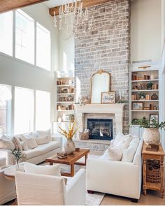 a living room filled with furniture and a fire place in the middle of a room