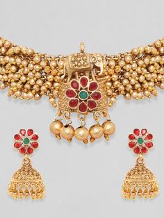 Gold-Toned & Plated 24K Handcrafted Ruby Ghungroo Temple Choker SetMaterial With Stone Type: Copper WIth Artificial StonesPlated: Gold-PlatingClosure: Drawstring ClosureA pair of Gold & Red Ghungroo Drop Earrings has post & back closure Size & Fit Size: Necklace: 24 cm; Earrings: 4.1 cm Material & Care Material: BrassPlating: Gold-PlatedClosure: DrawstringCare Instructions: Wipe your jewelry with a soft cloth after every use Always store your jewellery in a flat box to avoid accidental scratches Transitional Gold Lehenga With Cutdana, Festive 22k Gold Jhumkas For Ceremonial Occasions, Ceremonial 22k Gold Jhumkas For Festive Occasions, Gold Tilla Sets For Transitional Season, Festive Ceremonial 22k Gold Jhumkas, Gold Jhumkas For Ceremonial Festive Occasions, Transitional Gold Sets With Meenakari Detail, Transitional Gold Sets With Meenakari, Transitional Gold Meenakari Sets