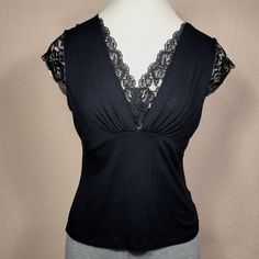 Black Sleeveless Blouse With Lace Details Nwot Soft, Sexy And Elegant Size: Small Petite Color: Black 95% Rayon 5% Spandex Black Stretch Camisole For Night Out, Stretch Black Camisole For Night Out, Fitted Camisole Tank Top For Night Out, Elegant Stretch Tank Blouse, Stretch Sleeveless Blouse For Night Out, Sleeveless Tops With Built-in Bra For Evening, Fitted Black Camisole Top, Elegant Black Camisole Blouse, Elegant Fitted Sleeveless Camisole