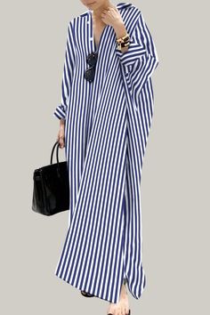 Effortlessly stylish and sophisticated, this striped oversized shirt dress is perfect for the warmer seasons. With a button front, a split neckline, and a high waistline, it exudes elegance and class. The long sleeves and drop shoulder design add a touch of artistry, while the straight hem and non-stretch fabric provide a luxurious finish. Perfect for the fashion-forward and discerning consumer. 95% Polyester, 5% Elastane Please allow 3-5 business days to process and ship. Product Measurements in cm : Size US Bust Length Sleeve Length Cuff S 4 90 130 72 31 M 6 94 131 73 32 L 8/10 100 132 74 33.5 XL 12 106 133 75 35 Striped V-neck Shirt Dress For Beach, Casual Oversized Striped Dresses, Striped Long Sleeve Maxi Dress For Summer, Long Sleeve Striped Maxi Dress For Summer, Chic Long Striped Dress, Elegant Striped Shirt Dress For Vacation, Striped Long Sleeve Maxi Dress For Work, Striped Long Sleeve Maxi Dress For Vacation, Striped Long Sleeve Maxi Dress For Daywear