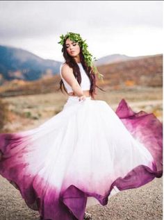 a woman in a white and purple dress