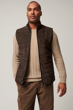 Our sporty and versatile Gavin vest is ready to take on cool-weather days. Made from soft yet durable lamb suede, this quilted leather vest is the perfect pick for fall adventures, from hiking amidst the changing leaves to taking in a Sunday football game. A classic cut with standup collar and full front zip pairs perfectly with your favorite jeans and boots, while four pockets offer space to store your keys and phone. Quilted Vest For Layering In Fall, Leather Winter Outdoor Vest, Outdoor Brown Leather Vest, Winter Outdoor Brown Vest, Brown Sleeveless Vest For Cold Weather, Quilted Sleeveless Outerwear For Fall, Quilted Sleeveless Fall Outerwear, Sleeveless Vest For Fall Hiking, Sleeveless Quilted Outerwear For Fall