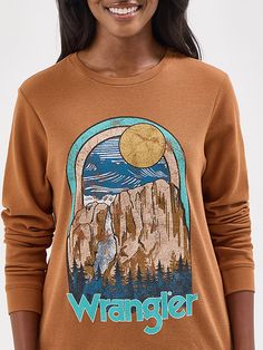 Bring a little bit of the Wild West wherever you go wearing our Women’s Long Sleeve Thermal Graphic Tee. It features a regular fit that’s a classic for a reason, cut straight from the sleeves to hip. This thermal crewneck shirt is crafted from cotton in a waffle knit for extra comfort when cooler days arrive. It features a retro-inspired graphic print full of Western iconography. Wrangler Women, The Wild West, Crew Neck Shirt, Graphic Tees Women, Wild West, Waffle Knit, Women's Tops, Retro Inspired, Women Long Sleeve