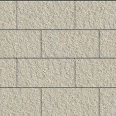 a white brick wall textured with cement