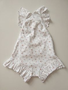 My Niayah Lace  Listing includes - 1 playsuit  Floral - sweet floral Base colour - ivory  Style - Tie up Frill shoulders and legs  Size- True to size  6 months  1 year 2 year 3 year If bubs it longer bodied always size up  Absolutely so gorgeous in a mini ditsy floral pattern customised and printed by My Niayah Lace Fabric  96% cotton  4% Spandex Stretchy breathable comfortable quality Cotton Bubble Romper For Spring Garden Party, Summer Cotton Onesie With Floral Print, Spring Garden Party Bubble Romper With Ruffles, Spring Garden Party Cotton Bubble Romper, Summer Cotton Bubble Romper With Floral Print, Summer Floral Print Cotton Bubble Romper, White Cotton Jumpsuits And Rompers With Floral Print, White Floral Print Bubble Romper For Playtime, Cute Floral Print Onesie For Summer