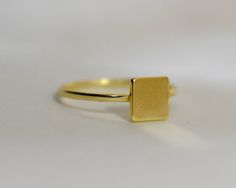 14 k yellow gold square id ring / stackable yellow gold dainty ring / delicate ring square engravable ring . Free shipping in the USA Handmade AND HAND ENGRAVED. SIMPLE AND DELICATE SOLID 14k GOLD SIGNET RING. THIS RING IS 14 K YELLOW GOLD BUT ALSO AVAILABLE IN WHITE GOLD OR ROSE GOLD . THE TOP SQUARE PLATE IS 4 MM. THE RING ITS SELF IS 1 MM . I CAN ENGRAVE A LETTER ON TO IT. EVERY RING SIZE IS AVAILABLE. A GREAT ADDITION TO A SIMPLE STACKABLE SET . METAL: 14 K YELLOW GOLD 585 SHIPPING TIME : 7 Minimalist Square Cut Signet Ring For Gift, Minimalist Square Cut Signet Ring As Gift, Minimalist Square Signet Ring Gift, Gold Rectangular Initial Ring Minimalist Style, Gold Rectangular Minimalist Initial Ring, Yellow Gold Square Rings For Anniversary, Square Yellow Gold Rings For Anniversary, Minimalist Initial Rectangular Promise Ring, Minimalist Rectangular Initial Promise Ring