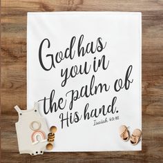 a white towel with the words god has you in the palm of his hand on it