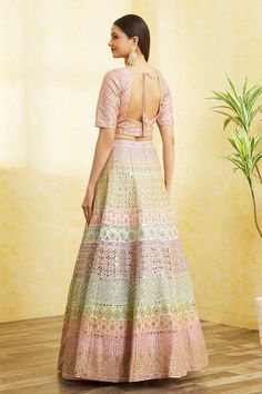 Multi colored colorblock lehenga with attached cancan, floral pattern mirror and gota work embroidery. Comes with embroidered, padded blouse and dupatta.
Component: 3
Pattern: Embroidered
Type Of Work: Mirror and Gota Work
Neckline: V-Neck
Sleeve Type: Short
Fabric: Dupion Silk
Color: Multi Color
Other Details: 
Back scoop neck blouse with tassel tie-up
Tasselled hem blouse
Semi sheer dupatta with embroidered borders
Lehenga with attached cancan
Padded blouse
Lehenga length: 42 inches
Closure:
B Multicolor Fusion Traditional Wear For Wedding, Festive Anarkali Multicolor Skirt Set, Multicolor Floor-length Sets For Navratri, Festive Multicolor Anarkali Skirt Set, Fitted Multicolor Palazzo Set For Wedding, Multicolor Fusion Sets For Weddings, Multicolor Fusion Style Wedding Sets, Multicolor Fusion Wedding Sets, Fusion Style Multicolor Lehenga With Cutdana