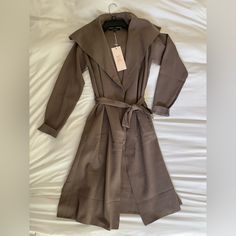 Nwt Long Taupe Cardigan With Oversized Collar Size Small, 100% Polyester. Never Been Worn, No Flaws Or Stains!! With Pockets! Features Oversized Collar For Expensive Look. Tie Belt Included. Adorable For Fall! #Longcardigan #Fallfashion #Boutiquefashion #Newwithtags #Mocha Long Brown Cardigan For Workwear, Long Brown Cardigan For Work, Chic Brown Long Sleeve Sweater Coat, Elegant Brown Outerwear For Day Out, Elegant Oversized Brown Cardigan, Elegant Brown Oversized Cardigan, Chic Taupe Cardigan For Fall, Fall Wrap Outerwear For Day Out, Beige Wrap Outerwear For Work