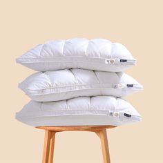 three pillows stacked on top of each other