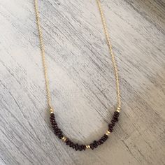 Garnet (red) and pyrite necklace Garnet natural stone chip necklace accented by gold plated pyrite beads. Finished with Function & Fringe signature gold feather charm at the clasp. Each necklace measures about 20 inches. Looks great layered with other necklaces. Other colors available. All Function & Fringe jewelry is designed and made with ❤️ in California! Function & Fringe Jewelry Necklaces Garnet Necklaces With Faceted Beads For Gifts, Gold Beaded Ruby Necklace, Garnet Bead Necklaces For Gifts, Garnet Beaded Necklaces As Gift, Garnet Gemstone Beads Necklace, Garnet Round Bead Necklace For Gift, Garnet Round Beads Necklace For Gift, Red Briolette Necklace With Faceted Beads, Gold Ruby Beaded Necklaces With Gemstone Beads