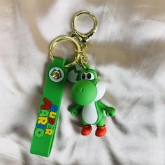 a green keychain with an image of a cartoon character on it