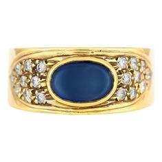 The ring is finely crafted in 18k yellow gold with diamonds weighing approximately total of 0.68 carat and center sapphire 1.25 carat. Circa 1970.