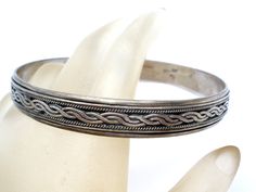 Vintage Fine Jewellery - This is a round sterling silver bangle bracelet with a braided design. It is hallmarked 925, weighs 24.5 grams, .38" wide, very well made. Silver Braided Bangle Bracelets, Traditional Silver Braided Bangle Bracelet, Silver Engraved Braided Bangle Bracelets, Engraved Silver Braided Bangle Bracelets, Silver Bangle Bracelet, Vintage Fine Jewelry, Sterling Silver Bangle Bracelets, Sterling Silver Bangle, Silver Bangle Bracelets