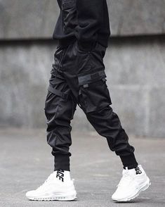 "Masaki" cargo pants - A techwear classic Size (cm) Waist Hips Length S 63-90 103 96.5 M 66-93 108 98 L 69-96 113 99.5 XL 72-99 118 101 XXL 76-103 123 103 XXXL 80-110 128 105 Choosing the "Masaki" Techwear cargo pants is a great idea for your wardrobe. Indeed, you like to fill your wardrobe with the best collections of pants? If so, then this is a model that deserves its place in your stuff. It is one of the most popular options on the market today. Now might be the time to take the opportunity Techwear Cargo Pants, Cyberpunk Pants, Hakama Pants, Techwear Pants, Techwear Outfits, Streetwear Pants, Military Outfit, Famous Fashion, Oversized Style