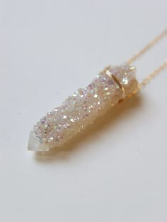 "Featuring a single beautiful Angel Aura Spirit Quartz Raw stone which was handcrafted into a 14k gold filled bezel set pendant piece. The stone has a pretty natural sparkle. This necklace highlights the beautiful elements of this arresting stone. The stone measures approx. 1.25\" long and 15mm wide. Chain is 18\" long. Handmade in my California studio This is a Limited Edition Piece Edition! Please allow for natural variation in crystals. No two are the same. They are unique just like you! Each Angel Aura Crystal, Raw Crystal Necklace, Spirit Quartz, Aura Crystals, Angel Aura Quartz, Beautiful Angel, Angel Aura, Color Corrector, Edgy Wallpaper