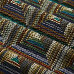 a close up view of a multicolored rug