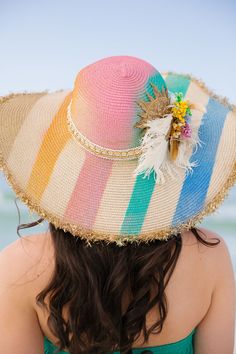 Bask in the sun with our Tropical Sunshine Sun Hat! The playful rainbow stripes add a pop of color while the cream and gold band adds a touch of elegance. Featuring white and gold feathers, bright flowers, and a gold sequin sun patch, this hat is perfect for adding some fun to your summer outfit. This hat is ONE OF A KIND, created by our owner Stephanie. To receive item quicker, expedited shipping is available at checkout. Gold Feathers, Bright Flowers, The Cream, Gold Sequin, Cream And Gold, Rainbow Stripes, Sun Hat, Gold Band, Sun Hats