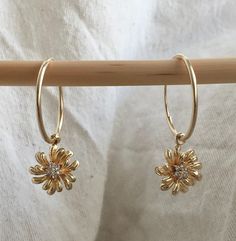 🌸 SPRING GLAM 🌸 Fresh flowers for spring A pair of Beautiful gold flower earring You can choose between a few finishes: 🌼 Dangle gold flower - The gold flower charm size about 10mm/1.5cm Round.It's made out of 2micron 14k gold plated with tiny Chz crystals In the shape of tiny flower in the middle. 🌼 Dangle 2 flowers - A colorful enameled flower with one of the colors available holding the gold flower. The tiny enameled flower size about: 0.5mm/1cm round. 🌼 Dangle gold flower and round diam Flowers For Spring, Gold Flower Earrings, Earrings Hanging, 2 Flowers, Flowers Earrings, Gold Coin Necklace, Flower Earring, Hanging Flower, Gold Medallion