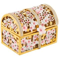 an ornately decorated wooden box with pink flowers on the sides and gold trimmings