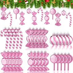 pink christmas ornaments and decorations hanging from a tree